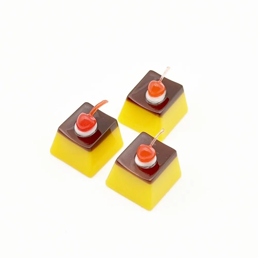 Keycap shaped like a custard pudding with a cherry on top