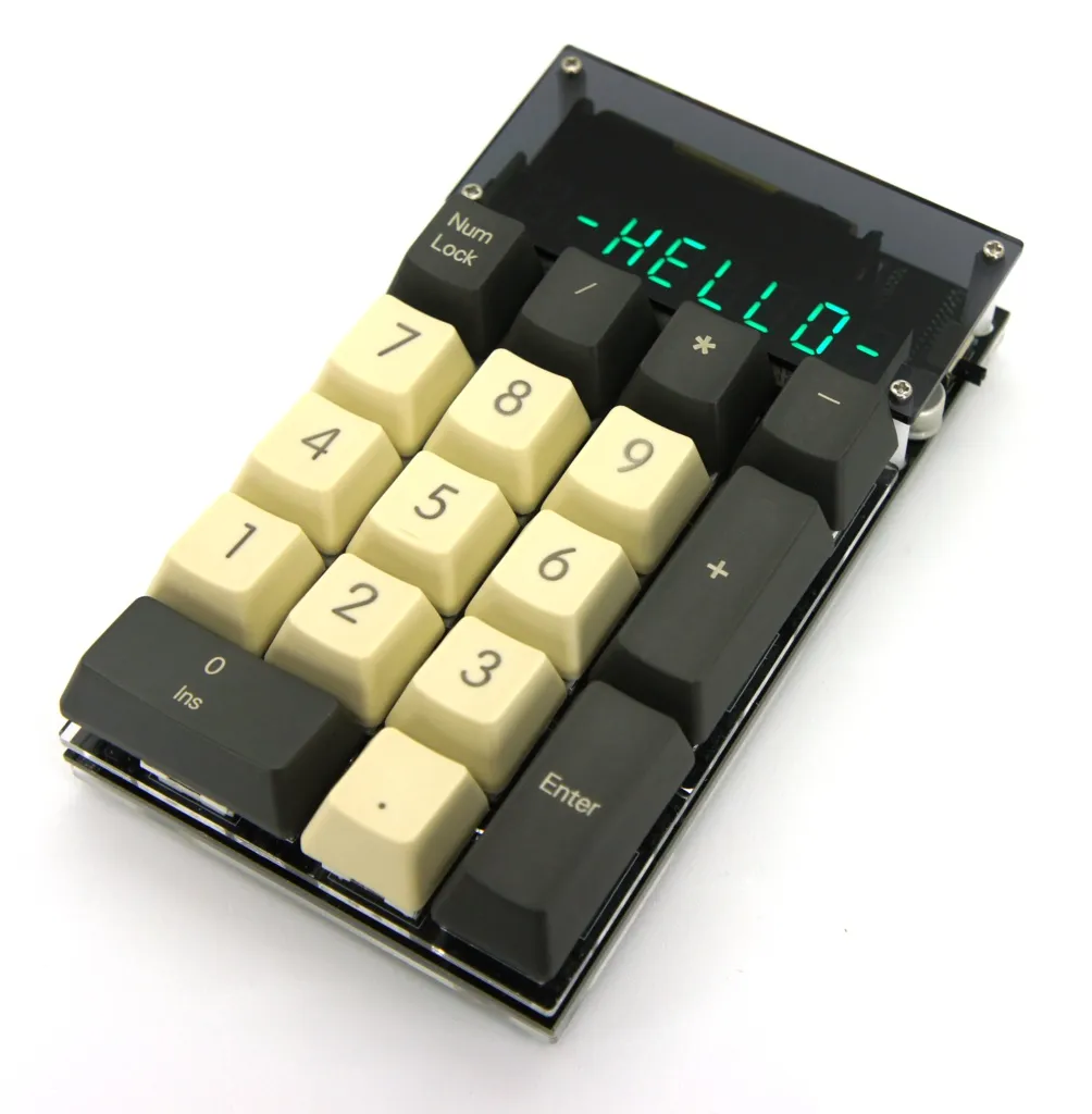 Small numeric keypad calculator kit built from keyboard switches, unassembled parts shown